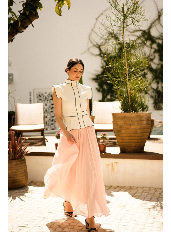 Ecru vest with black piping