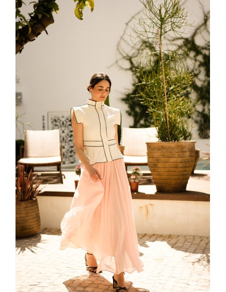 Ecru vest with black piping