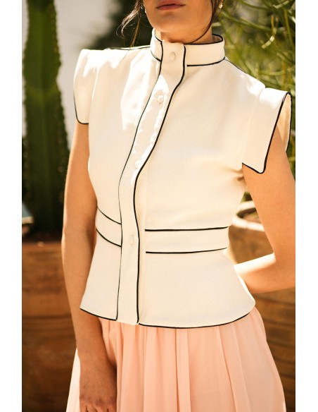 Ecru vest with black piping