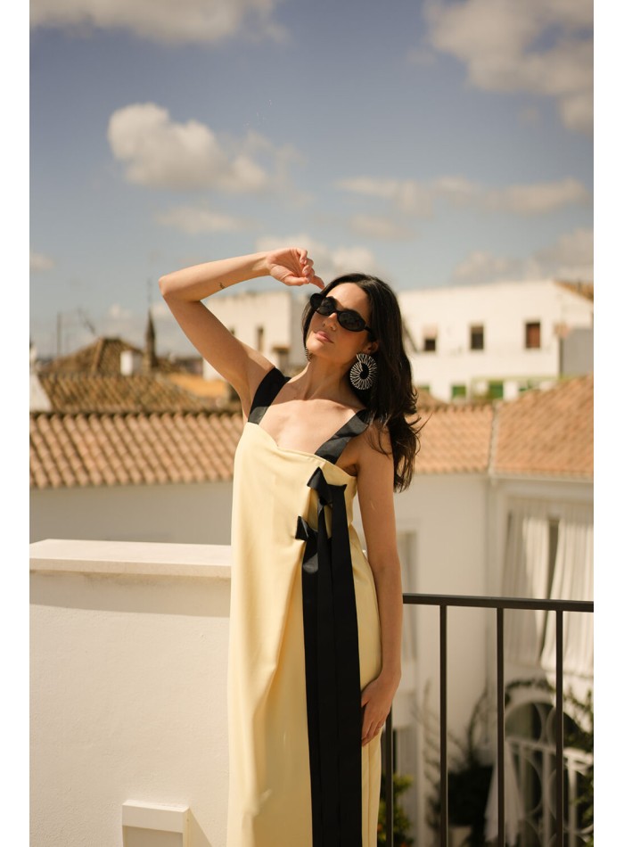 Long yellow dress with black bows