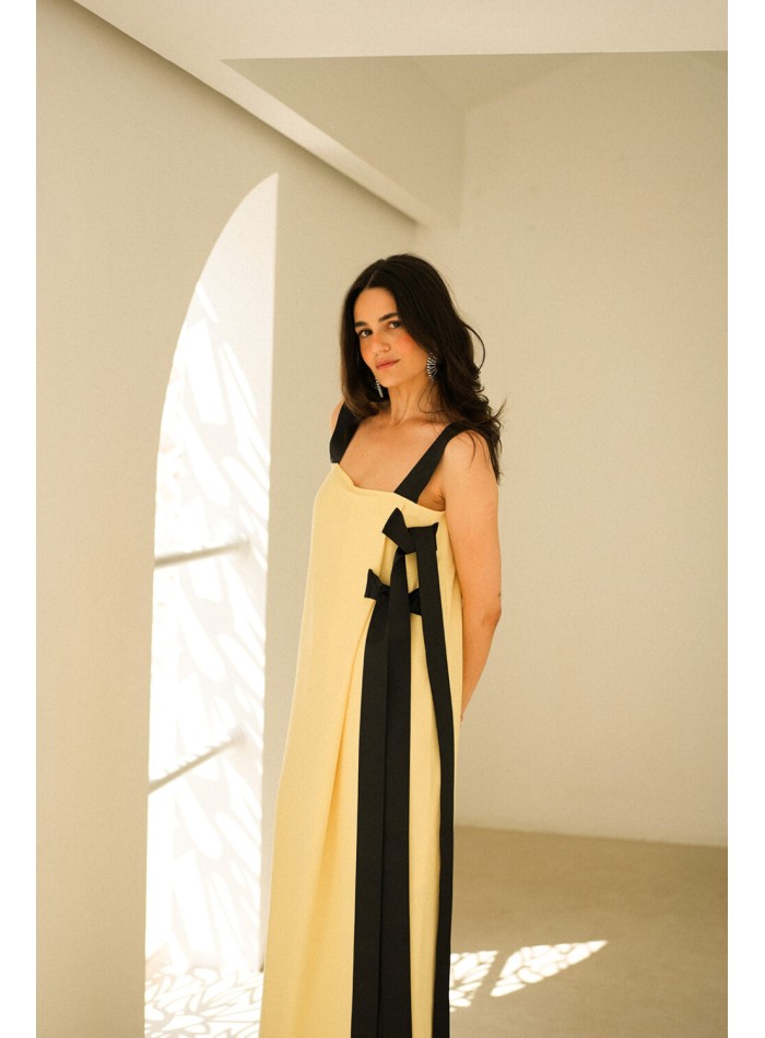 Long yellow dress with black bows