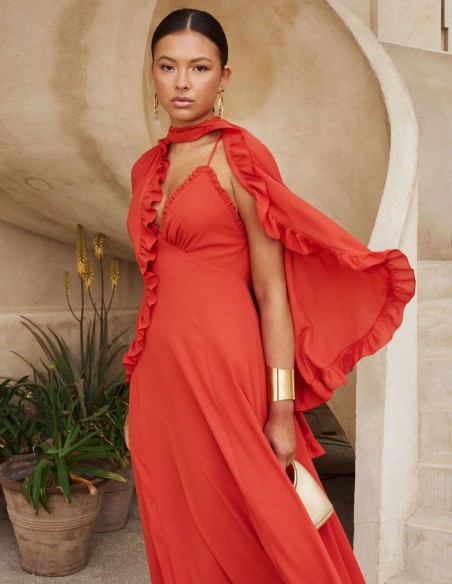 Long guest dress with thin straps and ruffle at the hem