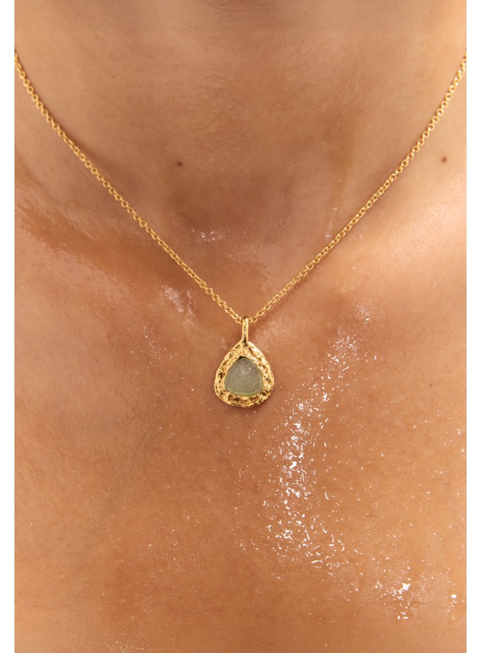 Long golden pendant with aquamarine stone