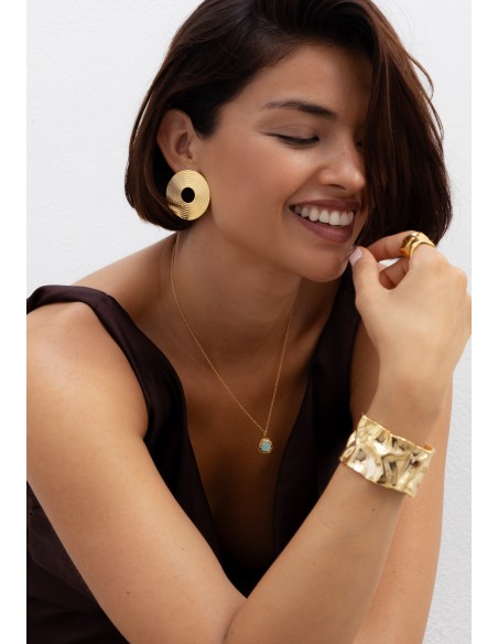 Long golden pendant with aquamarine stone