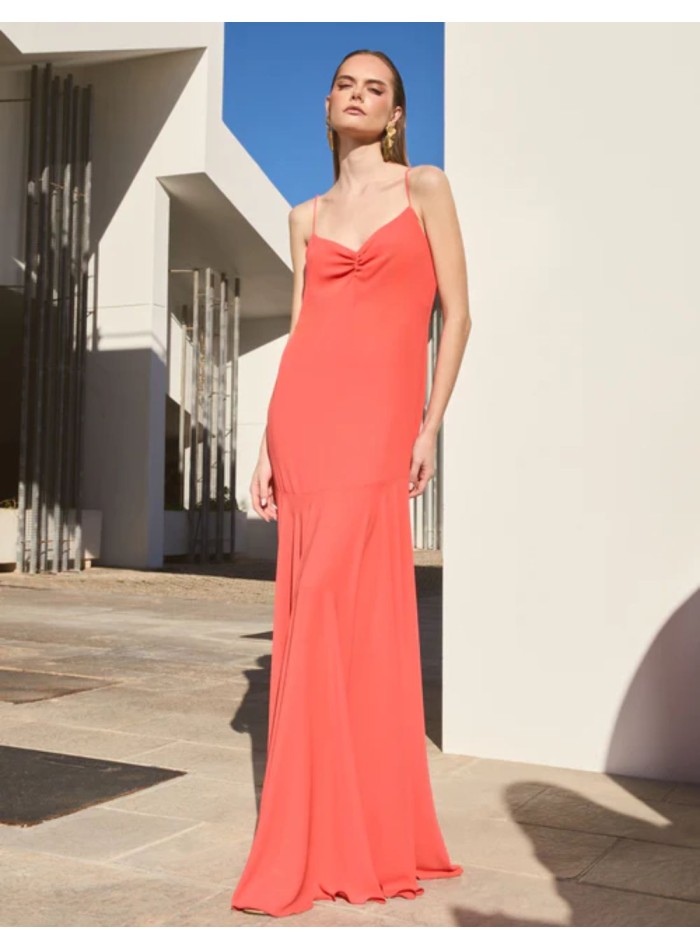 Long orange dress with ruffled neckline and...