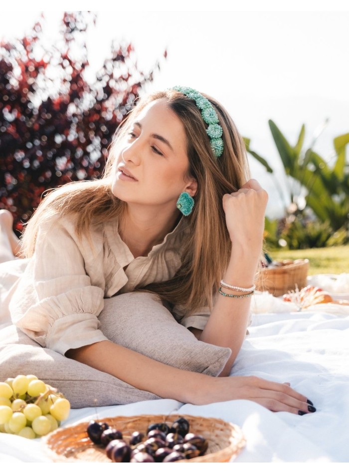 Earrings embroidered with beads and central...