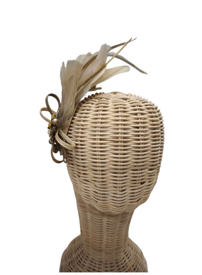 Guest headdress with beige feathers and beige...