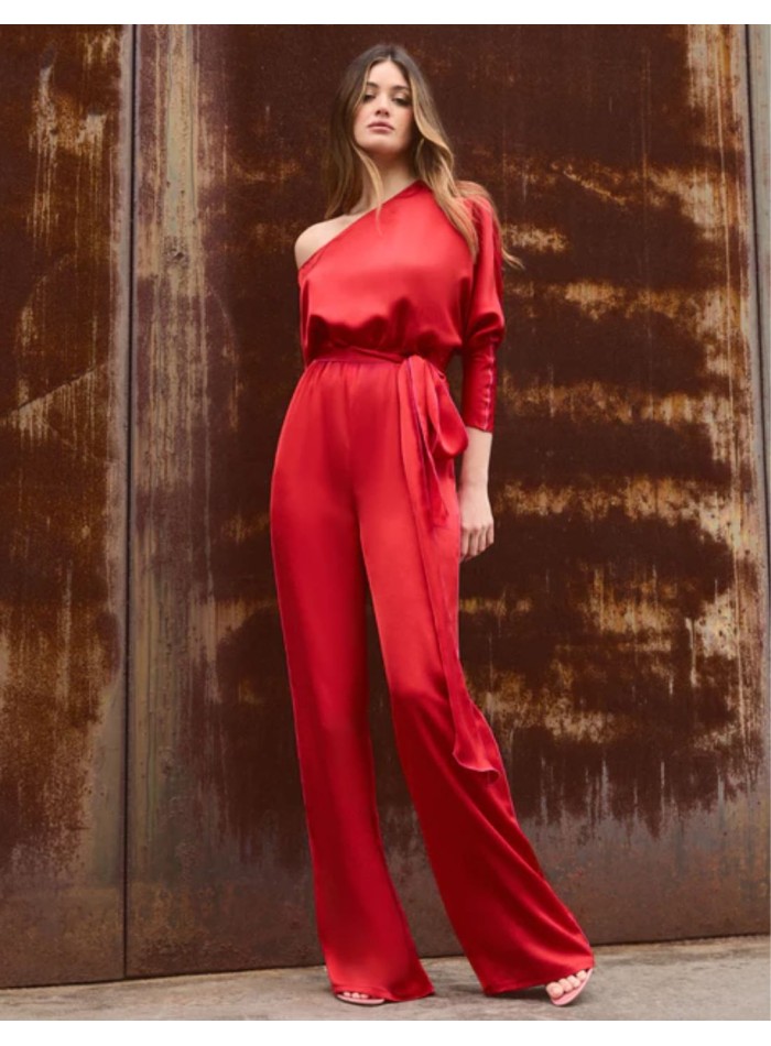 Asymmetric red jumpsuit with bat sleeves and belt