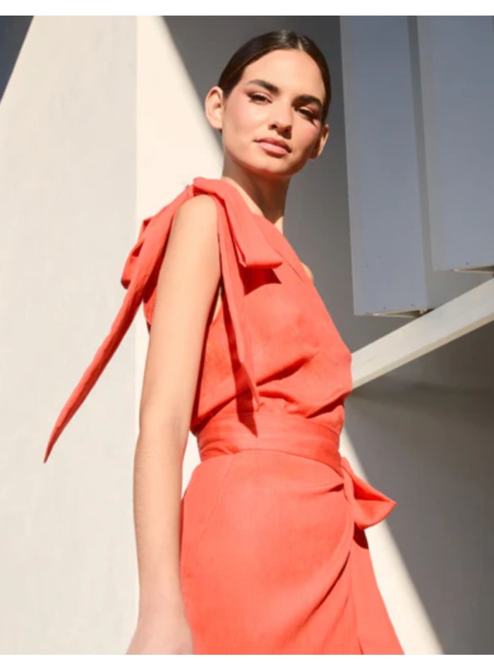 Orange asymmetrical top with lacing on the...