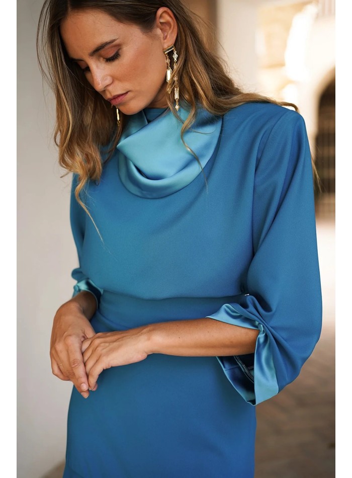 Elegant turquoise top with satin collar and cuffs