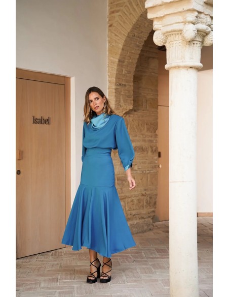 Elegant turquoise top with satin collar and cuffs