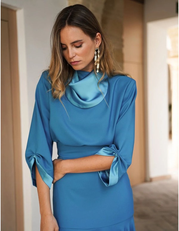 Elegant turquoise top with satin collar and cuffs