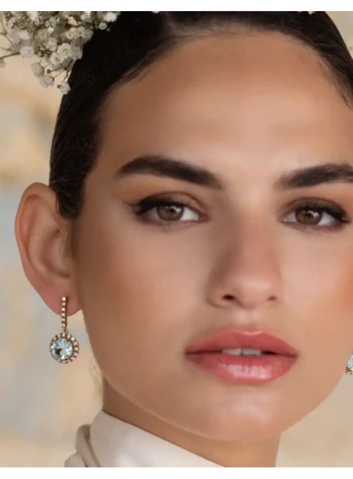 Earrings with aquamarine stone surrounded by...