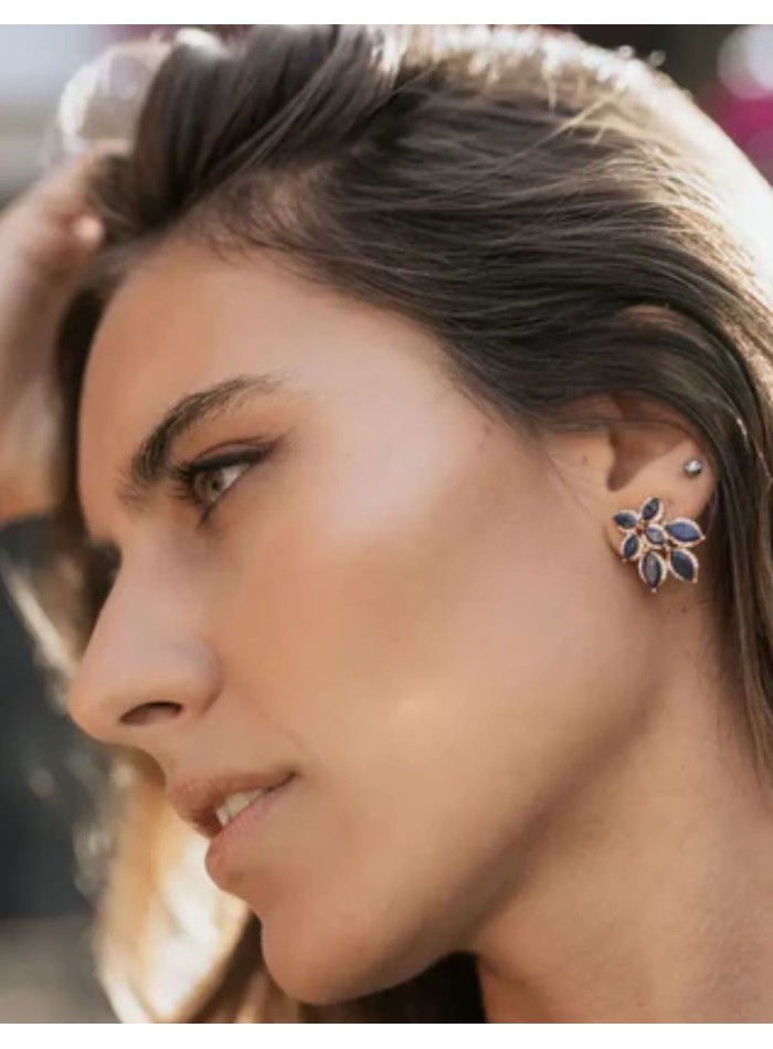 Earrings with flower design with blue stones...