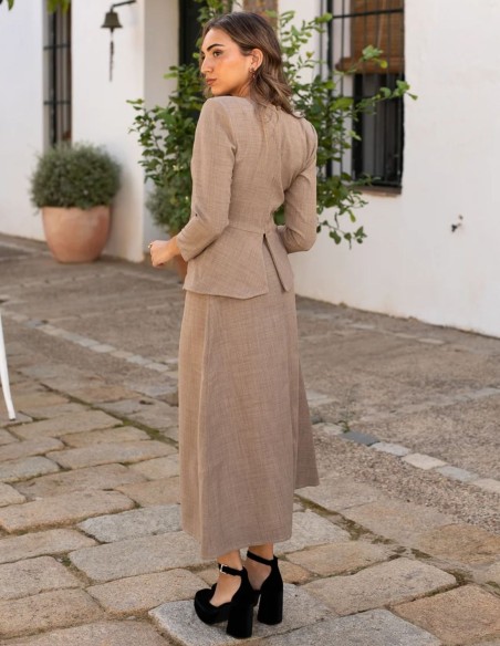 Beige long sleeve top with peplum waistband