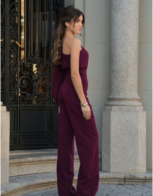 Long burgundy jumpsuit with asymmetrical neckline and...