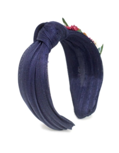 Navy blue headband with floral ornament on the side