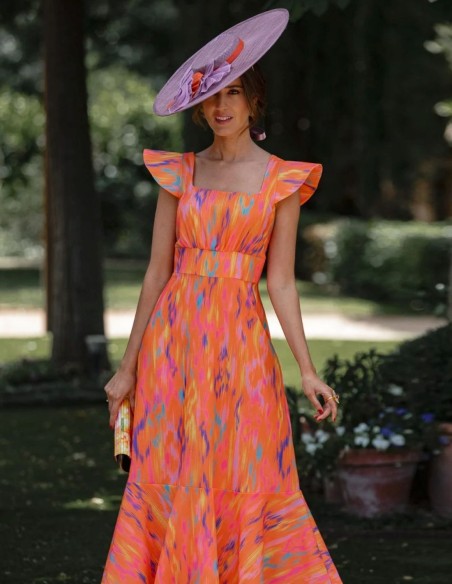 Pamela invitée en sinamay mauve avec détails orange