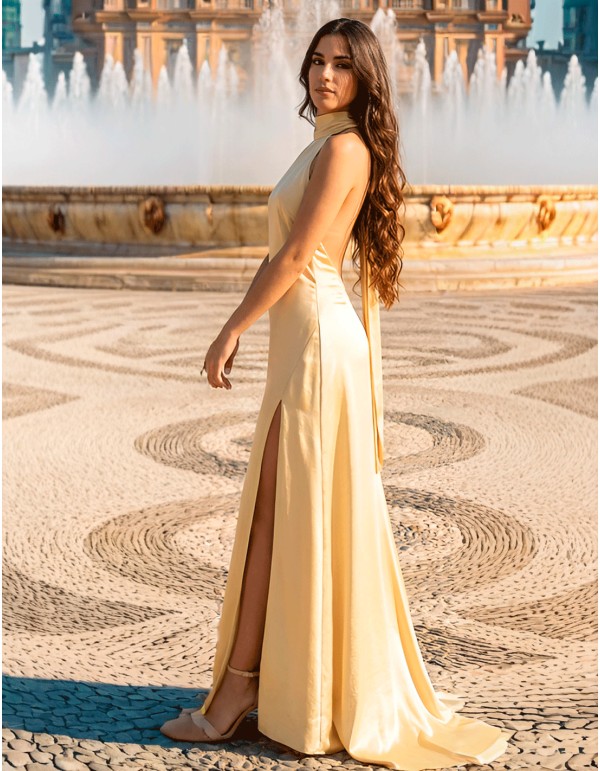 Pastel yellow satin prom dress with halter neckline and...