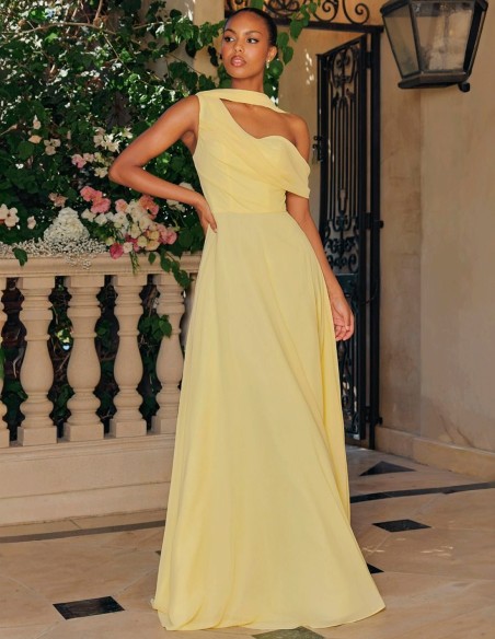 Pastel yellow long gown with asymmetrical neckline and cape sleeves