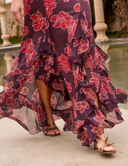 Asymmetrical midi skirt with floral print in eggplant color