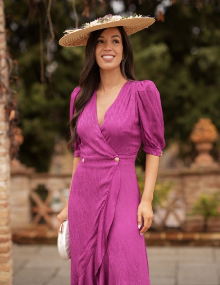 Midi guest dress with asymmetrical hem and flowing fabric