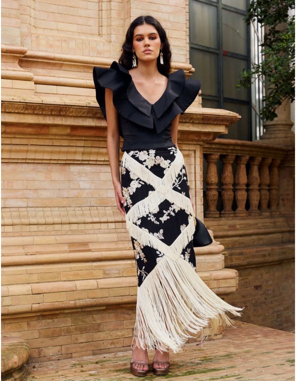 Falda midi negra con bordado floral y flecos en color marfil