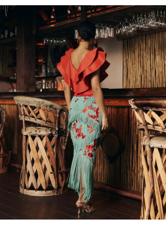 Red taffeta top with ruffles at the neckline...