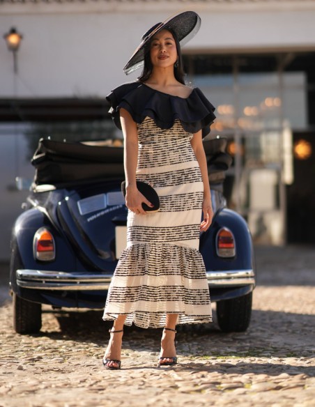 Guest outfit with asymmetrical neckline and midi skirt