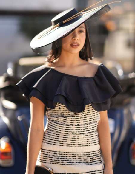 Guest outfit with asymmetrical neckline and midi skirt