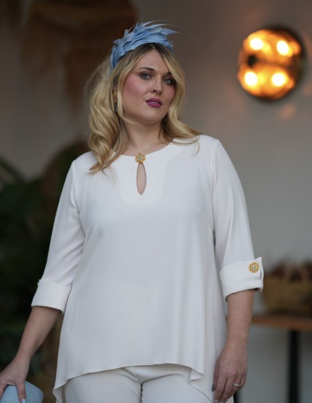 Ecru two-piece ensemble with rhinestone detail on cuffs and neckline