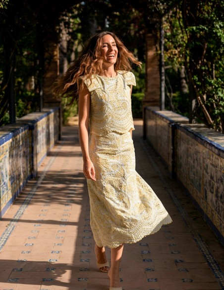 Yellow die-cut set of structured top with shoulder pads and mermaid skirt