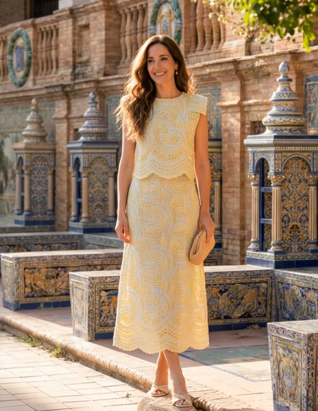 Yellow die-cut set of structured top with shoulder pads and mermaid skirt