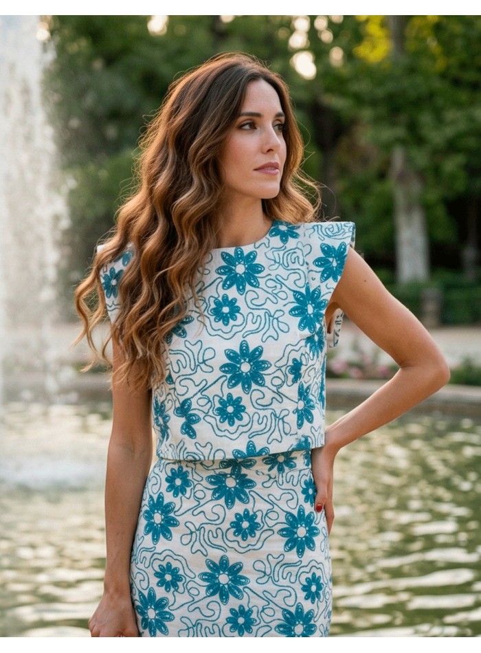 Blue embroidered ensemble with structured top...