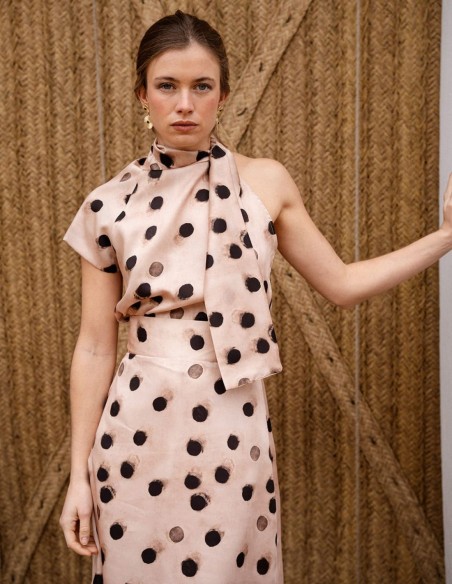 Asymmetrical short sleeve top with polka dot print and lacing