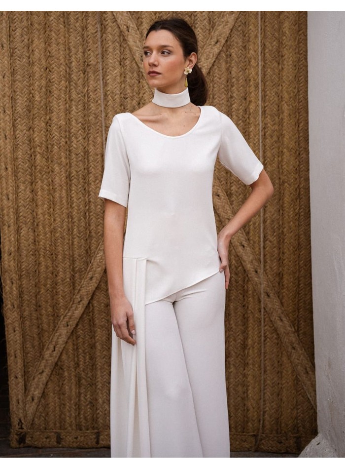 Short sleeve crepe top with asymmetrical cut...