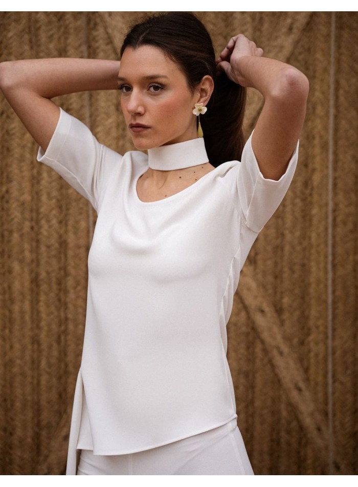 Short sleeve crepe top with asymmetrical cut...