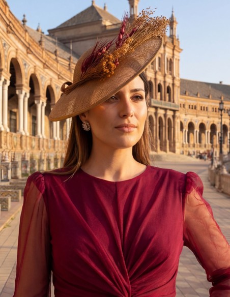 Guest headdress made of raffia with preserved bougainvillea colored flowers