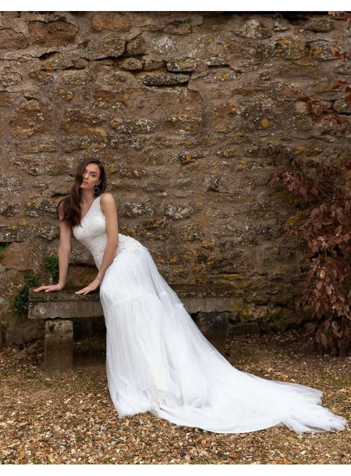 Wedding dress with rhinestone embroidery and bare shoulder