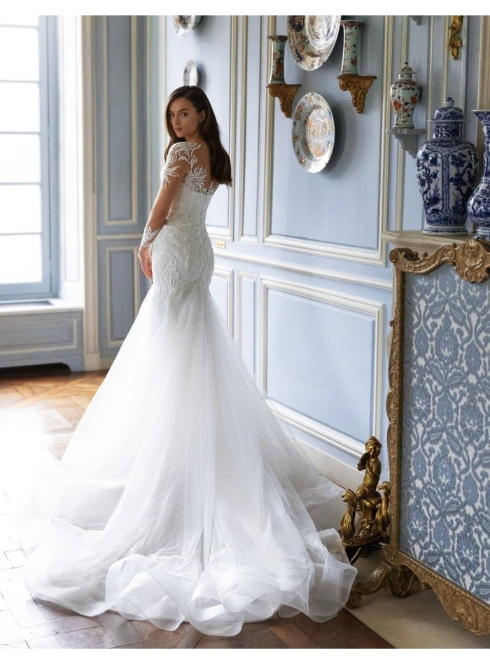 Wedding dress with embroidered tattoo effect sleeves and voluminous tail from Pollardi