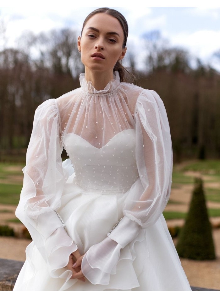 Wedding dress with long sleeves and layered skirt at INVITADISIMA