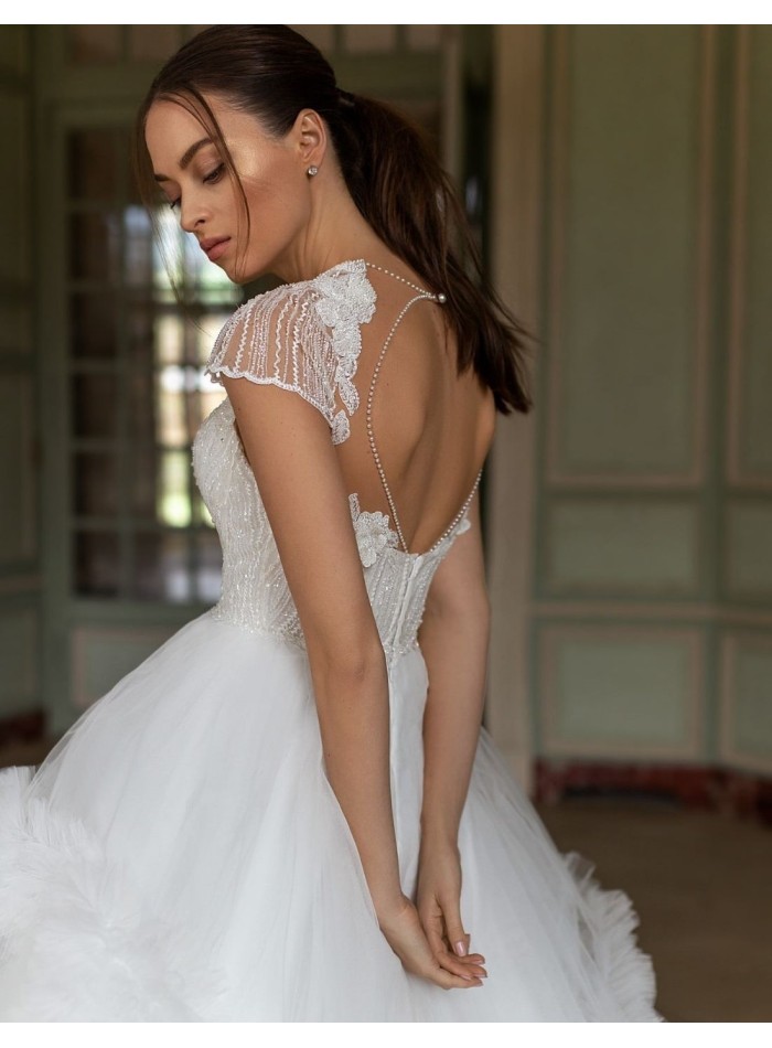 Wedding dress with rhinestone bodice and pompous skirt at INVITADISIMA