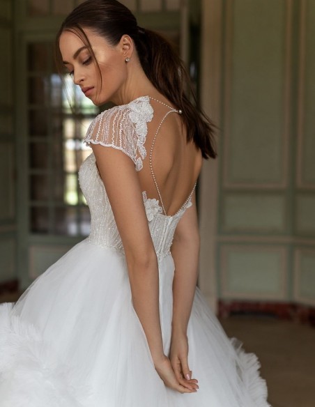 Wedding dress with rhinestone bodice and pompous skirt at INVITADISIMA
