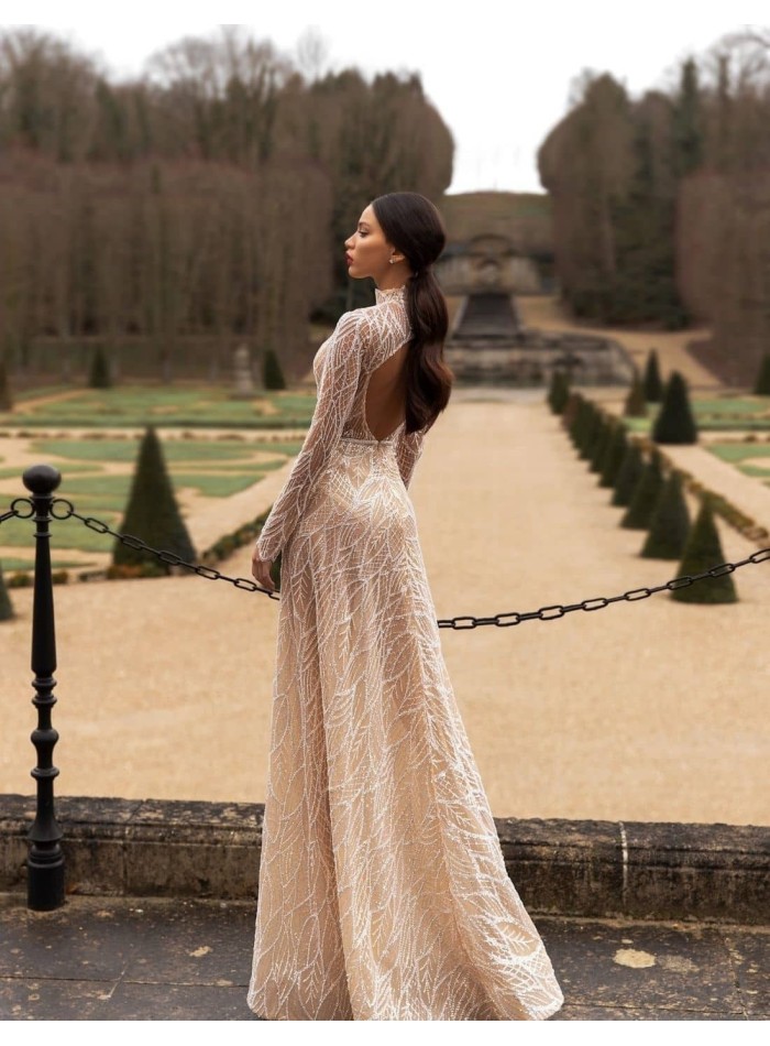 Wedding dress with beaded embroidery and long sleeves