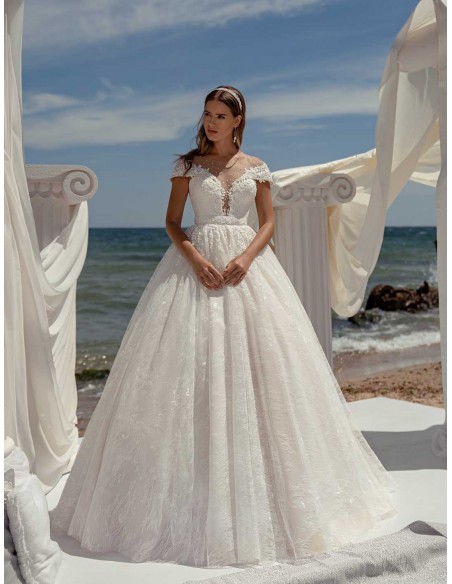 Princess cut wedding dress with boat neckline and long sleeves with transparent back by ANNIE VICTOR at INVITADISIMA