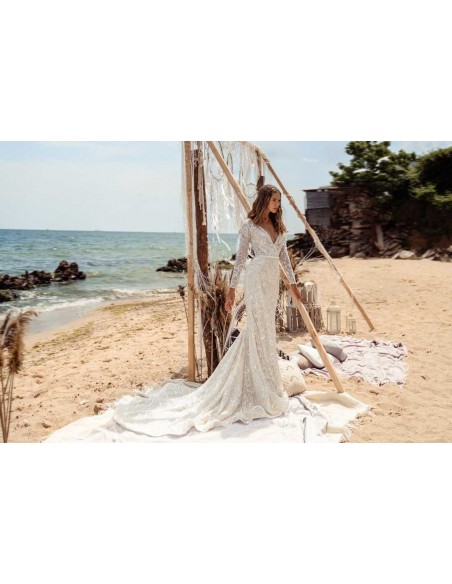 Flared wedding dress with crossover V-neckline and luxurious semitransparent lace by ANNIE VICTOR