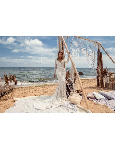 Flared wedding dress with crossover V-neckline and luxurious semitransparent lace at INVITADISIMA