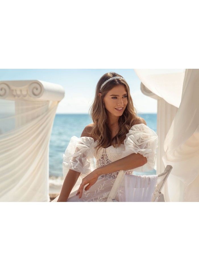 Evasée wedding dress with strapless neckline and open back in beautiful embroidered tulle