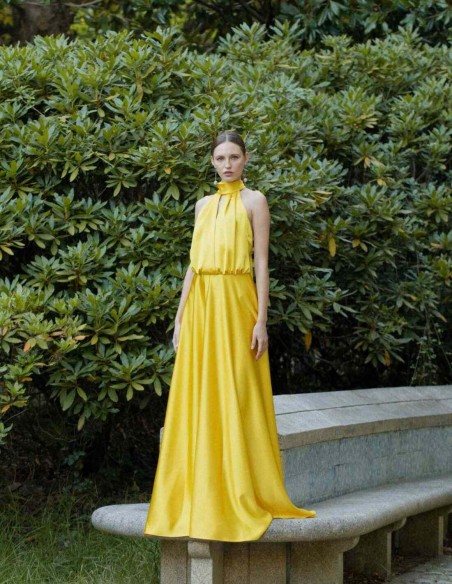 Long yellow dress with halter neckline and spaghetti straps