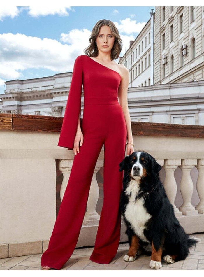 Red long party jumpsuit with asymmetric neckline and long caped sleeve for guests